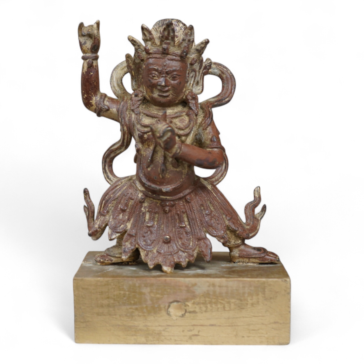 A Buddhist gilt bronze figure of Vaishravana, possibly Tibetan, 21 cm including wooden stand.